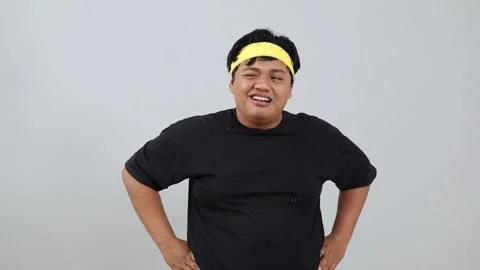 Asian young overweight man is feeling tired isolated over a white background in Stock Footage 342229599