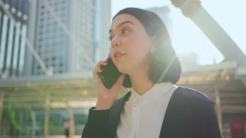 Asian young smart businesswoman talking on the telephone in the city. Stock Footage