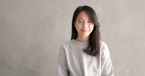 Asian young woman smile to camera Stock Footage