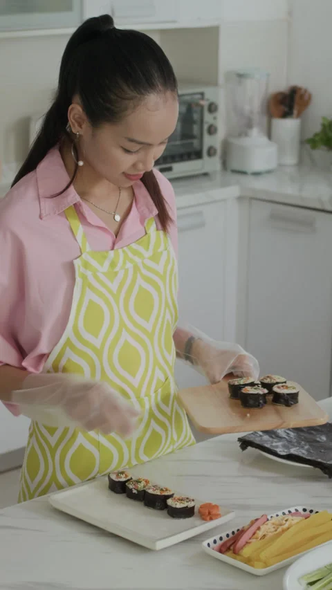 Asian Zoomer Serving Dinner with Self-made Kimbap Stock Footage 282237300