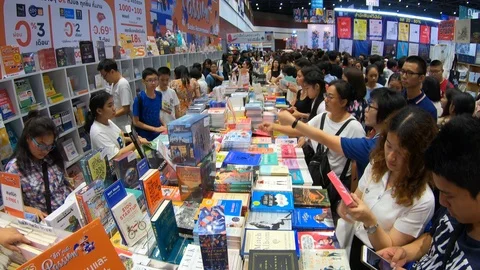 Asians at book stall Stock Footage 105507855