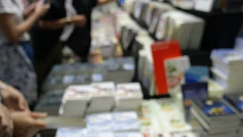 Asians at book stall Stock Footage 246855058