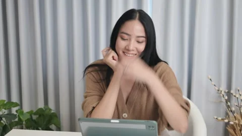 Asians use laptop computers to make video calls. meeting with friends Stock Footage 197498902
