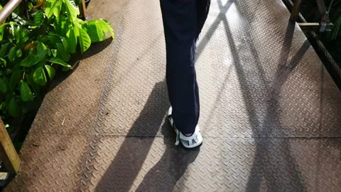 Asians walking to the beach using iron bridges. Slow motion. Stock Footage 206327161