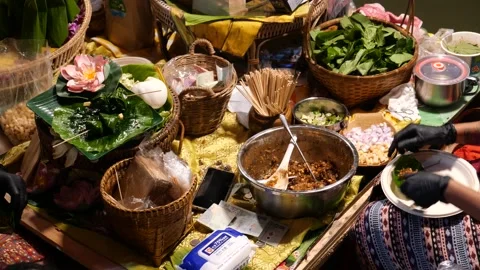 Asia’s leaf wrap appetizer with different ingredients of herbs Stock Footage 228453876