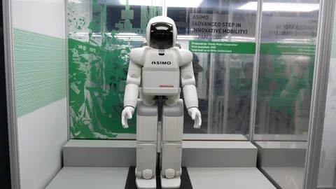 ASIMO Humanoid Robot at Exhibition Science Museum. Engineered by Honda, 2000 Stock Footage 116681782