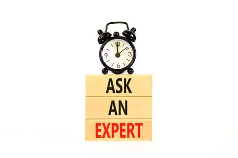 Ask an expert symbol. Concept words Ask an expert on wooden blocks on a beaut Stock Photos