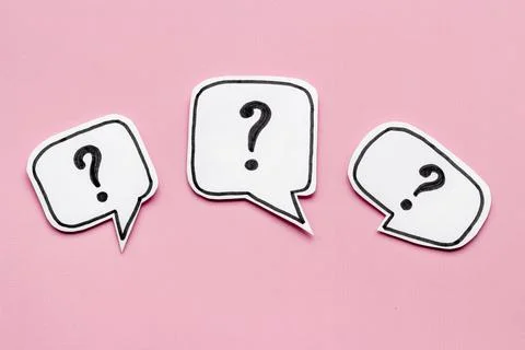 Ask question concept. Question mark on speech bubbles, top view Stock Photos