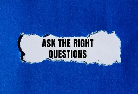 Ask The Right Questions message written on ripped torn paper background. Co.. Stock Photos