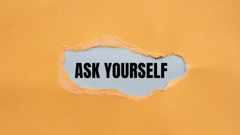 Ask yourself message writing on ripped torn orange paper on gray background Stock Footage 282595273