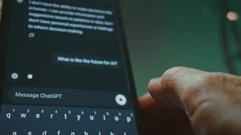 Asking Chat GPT on smartphone about the future of AI Stock Footage 288969472