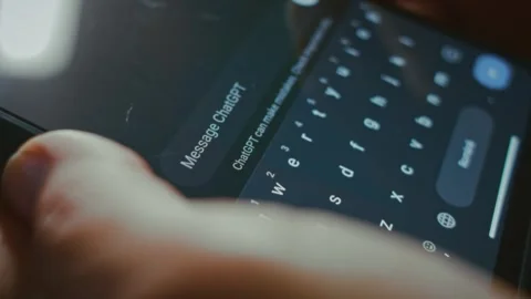 Asking Chat GPT on smartphone a question Stock Footage 288969709