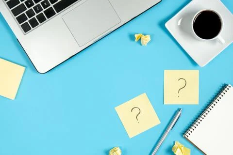 Asking, Decisions. Question mark on sticky notes, notebook, cup coffee Stock Photos