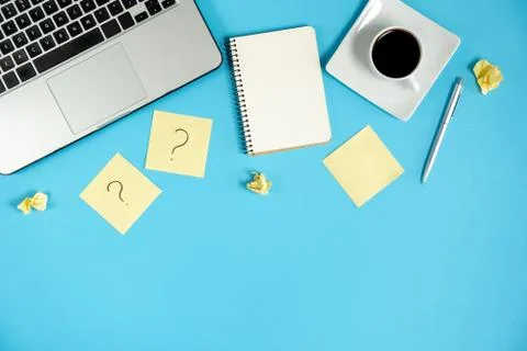 Asking, Decisions. Question mark on sticky notes, notebook, cup coffee Stock Photos
