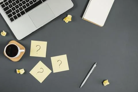 Asking, Decisions. Question mark on sticky notes, notebook, cup coffee Stock Photos