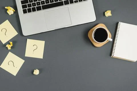Asking, Decisions. Question mark on sticky notes, notebook, cup coffee Stock Photos