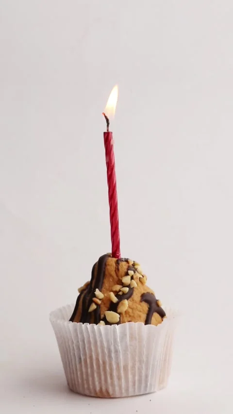 ASMR Close-up of Red Candle on Chocolate Muffin in Time-lapse Stock Footage 310966938