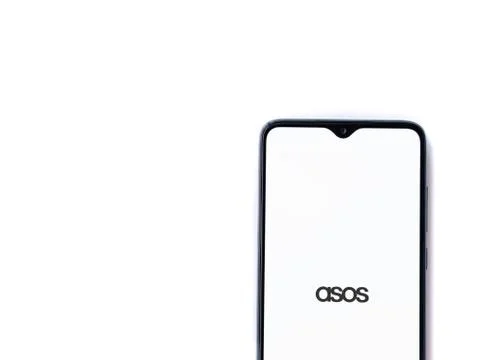 ASOS app launch screen with logo on the display of a black mobile smartphone  Stock Photos