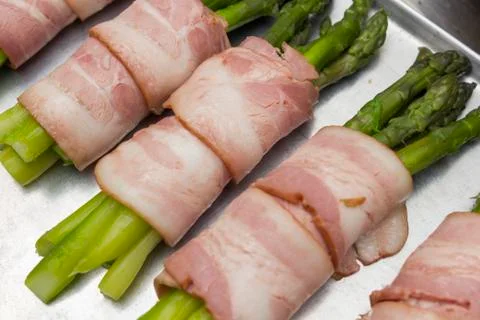 Asparagus with bacon Stock Photos
