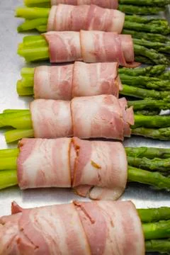 Asparagus with bacon Stock Photos