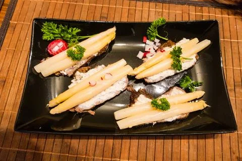 Asparagus on black bread. 스톡 사진