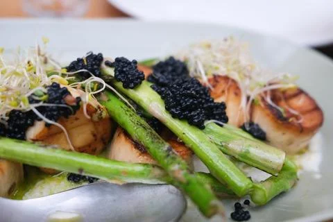 Asparagus with caviar Stock Photos