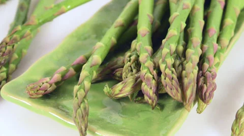 Asparagus falling on plate Stock Footage 36157230