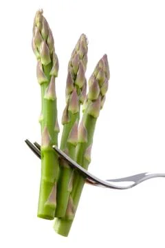 Asparagus on a fork isolated Stock Photos
