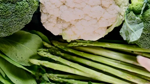 Asparagus Is Placed on Top of a Set of Fresh Green Vegetables, Healthy Nutrition Видео 136423428
