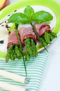 Asparagus with speck Stock Photos
