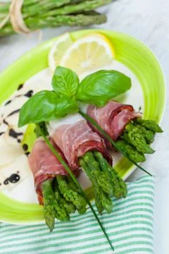 Asparagus with speck Stock Photos