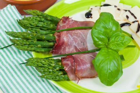 Asparagus with speck Stock Photos