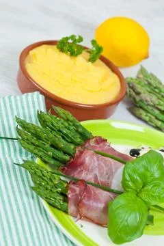 Asparagus with speck Stock Photos
