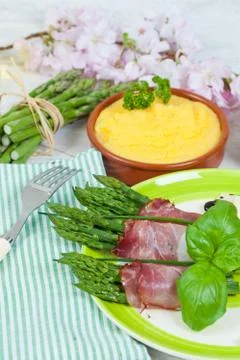 Asparagus with speck Stock Photos