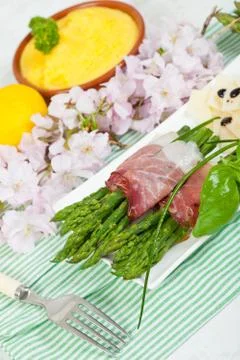 Asparagus with speck Stock Photos