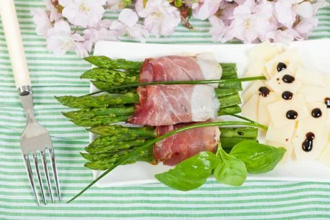 Asparagus with speck Stock Photos