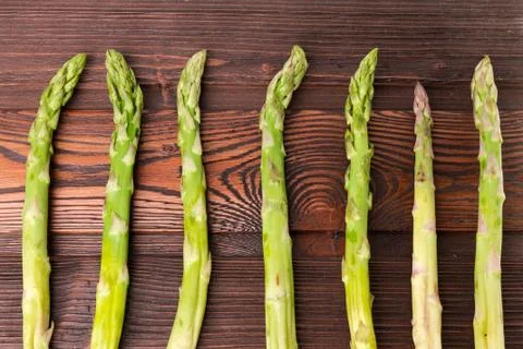 Asparagus on wooden background Stock Photos