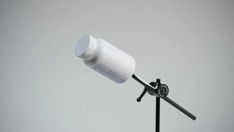 Asperin on turntable on white Stock Footage 160379829