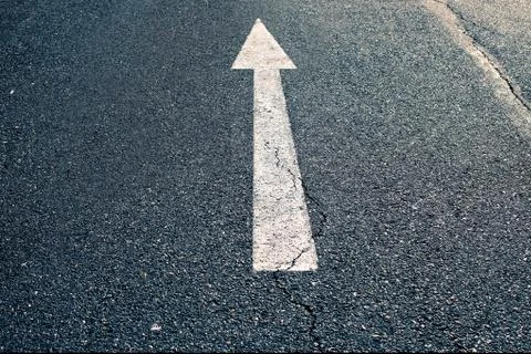 Asphalt with arrow on surface Stock Photos