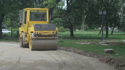 Asphalt compactor or road roller during flattening ground before paving. 스톡 동영상 77027816