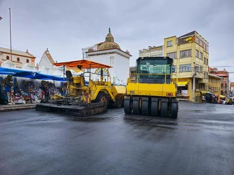 Asphalt construction machinery in the process of building platforms Stock Photos