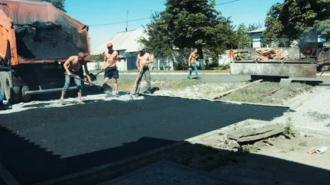 Asphalt laying by manual method Stock Footage 98362131