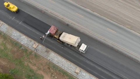 Asphalt machine and steamroller operator job Video stock 88360517
