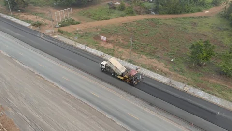Asphalt machine and steamroller operator job Stock Footage 88360601