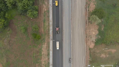 Asphalt machine and steamroller operator job Stock Footage 88360877