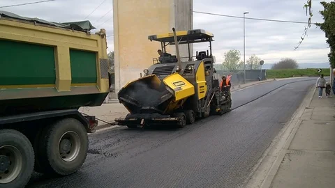 Asphalt machine at work to repair an old road Video stock 88677642