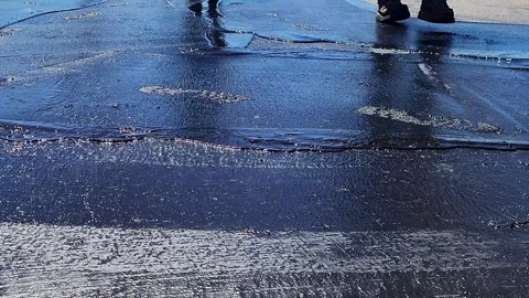Asphalt maintenance technicians  working on new pavement Video stock 342479091