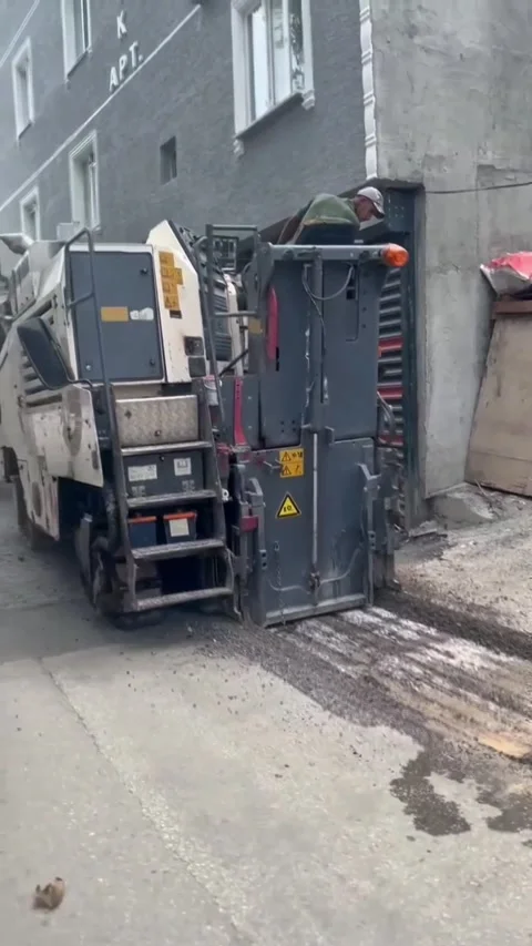 Asphalt Milling Machine Removing Old Road Surface – Rear View Stock Footage 323654565