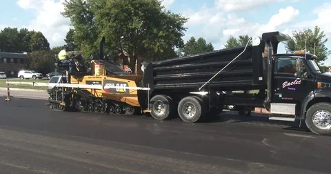 Asphalt Paver with Dump Truck Stock Footage 78551920