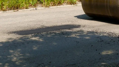 Asphalt paver makes a patch on the road Video stock 87956261